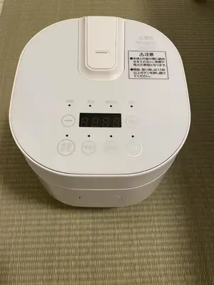 a white machine is sitting on the floor at \u30b5\u30af\u30e9\u30b7\u30e3\u30c9\u30a6\u9280\u5ea7502 in Tokyo