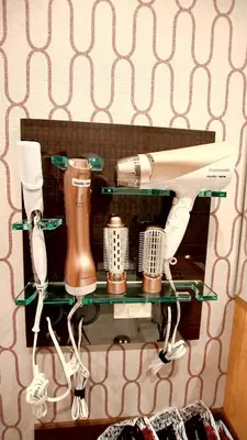 a shelf with a hair dryer and other items on it at \u304a\u5bbf\u5be7\u3005OyadoNene\u677f\u6a4b \u6c60\u888b3\u5206\u65b0\u5bbf9\u5206 in Tokyo