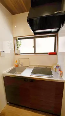 a kitchen with a sink and a counter top at \u304a\u5bbf\u5be7\u3005OyadoNene\u677f\u6a4b \u6c60\u888b3\u5206\u65b0\u5bbf9\u5206 in Tokyo