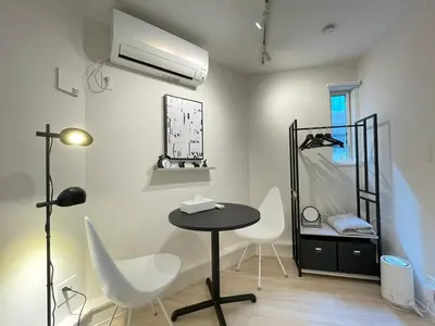 a room with a table and chairs and a mirror at \u5922\u306e\u5bbf \u6771\u4e2d\u91ce 134t in Tokyo