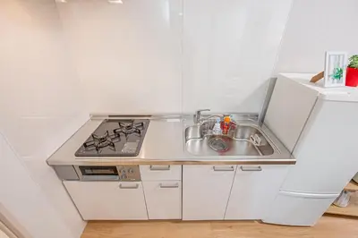 a small kitchen with a sink and a stove at \u65e5\u66ae\u91ccMori House B in Tokyo