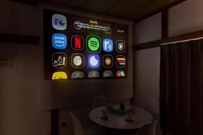an iphone screen on a wall in a room at Sushi Art Hotel at Kamiisshiki\u5bff\u53f8\u30a2\u30fc\u30c8\u30db\u30c6\u30ebat\u4e0a\u4e00\u8272 in Tokyo