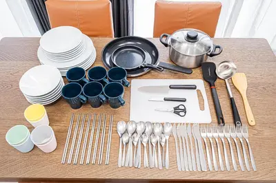 a table with plates and utensils on it at 67Apt Shinkoiwa in Tokyo