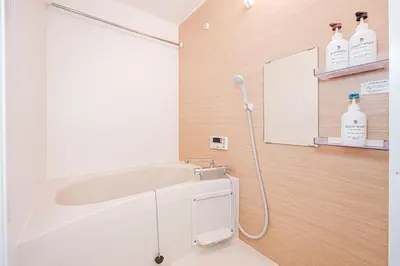 a bathroom with a shower and a white sink at 67Apt Shinkoiwa in Tokyo