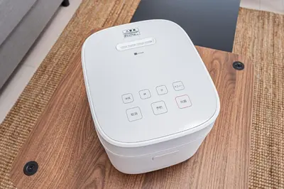 a white router sitting on top of a wooden table at 67Apt Shinkoiwa in Tokyo