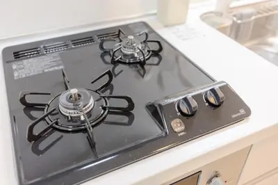 a stove top with two burners on top of it at Tell House in Tokyo