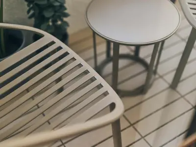 a white bench and a table and a table at illi Mia Kinshicho in Tokyo