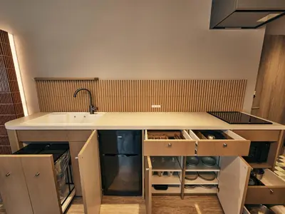 a kitchen with a sink and a counter top at illi Mia Kinshicho in Tokyo
