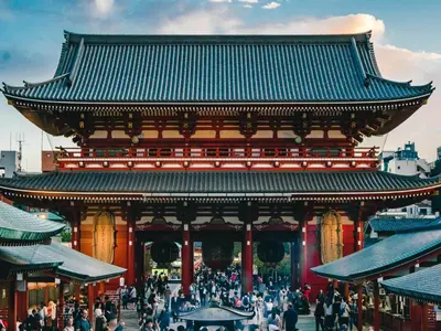 a large building with a crowd of people walking around it at illi Mia Kinshicho in Tokyo
