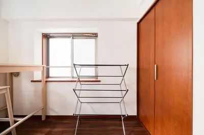 a metal shelf in a room next to a door at \u30ac\u30a4\u30a2\u6b4c\u821e\u4f0e\u753a\u58f1\u756a\u9928204 in Tokyo