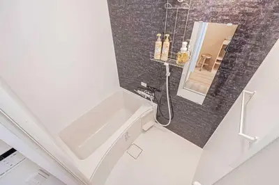 a bathroom with a sink and a mirror at Hotel Ginnan in Tokyo
