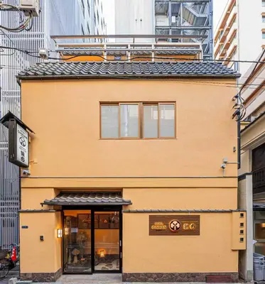 a building with a clock on top of it at Hotel Ginnan in Tokyo