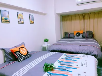 two beds sitting next to each other in a bedroom at Shinjuku House-1 in Tokyo