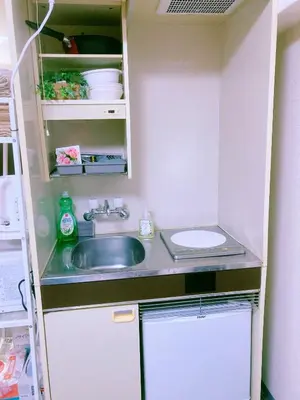 a small kitchen with a sink and a toilet at Shinjuku House-1 in Tokyo