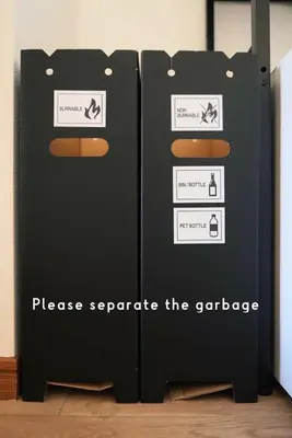 two black storage containers sitting next to a wall at Jetset haneda 105 in Tokyo