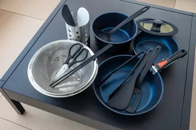 a blue cabinet with plates and utensils in it at \u30ea\u30bf\u30a4\u30f3\u4e2d\u4e95 in Tokyo