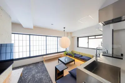 a kitchen and living room with a large window at \u30ea\u30bf\u30a4\u30f3\u4e2d\u4e95 in Tokyo