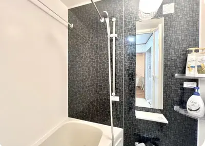 a bathroom with a shower and a sink and a tub at Kitashinjuku 107-SJ0014 in Tokyo