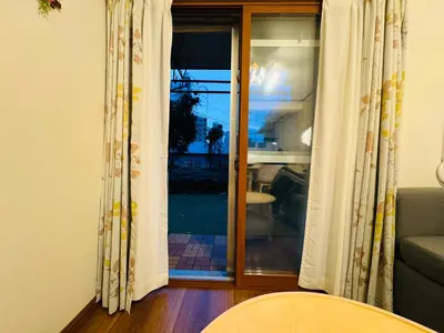 a living room with a sliding glass door at Kitashinjuku 107-SJ0014 in Tokyo