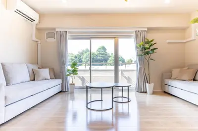 a living room with a couch and a table at Parkview, 3min by Train to Shibuya, 5min by Train to Shinjuku in Tokyo