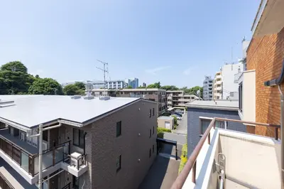 a view from the balcony of a building at Parkview, 3min by Train to Shibuya, 5min by Train to Shinjuku in Tokyo