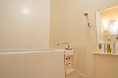 a white refrigerator in a kitchen with milk bottles at Belle Lead 106 in Tokyo
