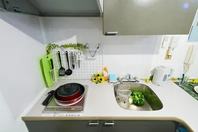 a kitchen counter top with a sink and a counter top at SC 202 Cozy Private Stay with Loft Near Station Free WiFi in Tokyo