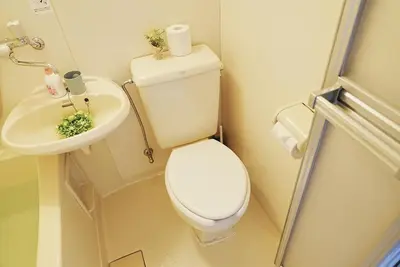 a small bathroom with a toilet and a sink at SC 202 Cozy Private Stay with Loft Near Station Free WiFi in Tokyo