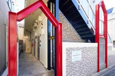 a red entrance to a building with a sign on it at SC 202 Cozy Private Stay with Loft Near Station Free WiFi in Tokyo