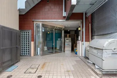 an entrance to a building with an open door at JAPT Gotanda in Tokyo