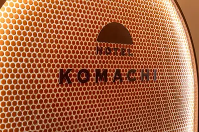 a close up of a red speaker with a koyaota sign on it at HOTEL KOMACHI TOKYO Higashi Nippori in Tokyo