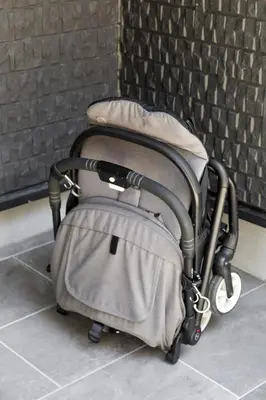 a stroller sitting next to a brick wall at Shinjuku large 3LDK 2 bathrooms, brand NEW house built in 2025 - Lotus Villa in Tokyo