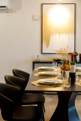 a dining room with a table with chairs and a painting at Shinjuku large 3LDK 2 bathrooms, brand NEW house built in 2025 - Lotus Villa in Tokyo