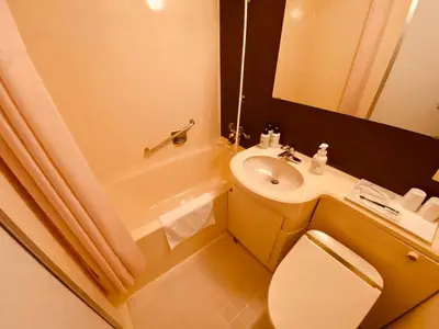 a bathroom with a sink and a toilet and a bath tub at Smile Hotel Tokyo Nishikasai - Vacation STAY 97145v in Tokyo