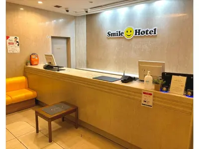 a smile hotel counter with two laptops on it at Smile Hotel Tokyo Nishikasai - Vacation STAY 97266v in Tokyo
