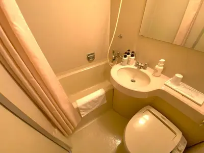 a small bathroom with a toilet and a sink at Smile Hotel Tokyo Nishikasai - Vacation STAY 97133v in Tokyo