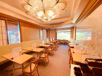 a dining room with tables and chairs and a chandelier at Smile Hotel Tokyo Nishikasai - Vacation STAY 97283v in Tokyo