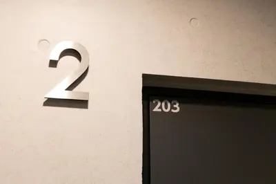 a door with the number on a wall at HeureuxShiinamachi - Vacation STAY 19769 in Tokyo