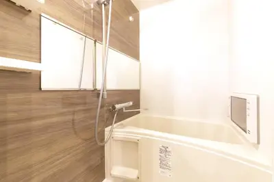 a bathroom with a shower with a bath tub at HeureuxShiinamachi - Vacation STAY 19769 in Tokyo