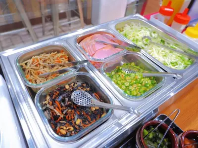 a buffet with four trays of food on a table at Kamata Inn Social - Vacation STAY 03288v in Tokyo
