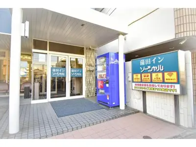 a store front of a building with a blue door at Kamata Inn Social - Vacation STAY 03309v in Tokyo