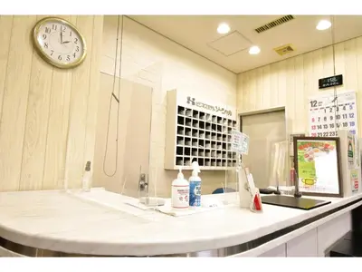 a clock on a wall above a counter in a pharmacy at Kamata Inn Social - Vacation STAY 03328v in Tokyo