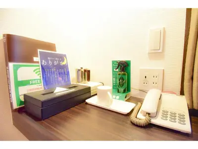 a desk with a cash register and a telephone at Kamata Inn Social - Vacation STAY 03328v in Tokyo