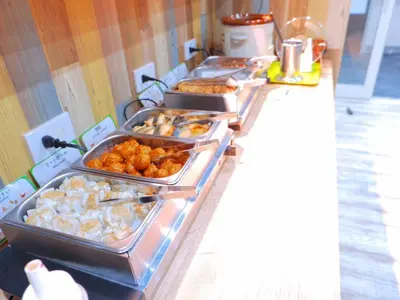 a buffet line with trays of food on it at Kamata Inn Social - Vacation STAY 03314v in Tokyo