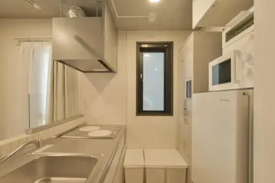 a kitchen with a sink and a refrigerator at La Residence East Tokyo201 - Vacation STAY 19856 in Tokyo