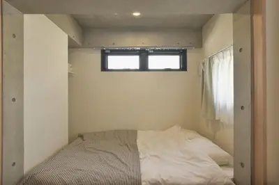 a bed in a small room with a window at La Residence East Tokyo201 - Vacation STAY 19856 in Tokyo