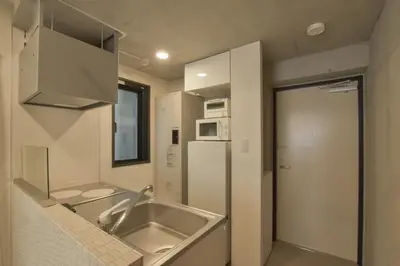 a kitchen with a sink and a refrigerator at La Residence East Tokyo201 - Vacation STAY 19856 in Tokyo