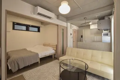a living room with a couch and a bed at 3-17-9 Mukojima - Vacation STAY 19858 in Tokyo