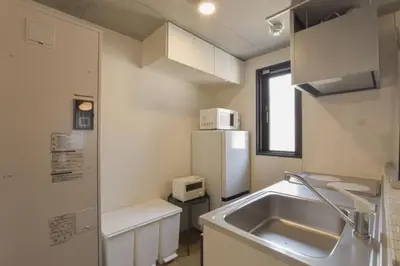 a small kitchen with a sink and a refrigerator at La Residence East Tokyo202 - Vacation STAY 19859 in Tokyo