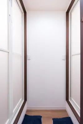 a room with white walls and windows at Wakabayashi house in Tokyo